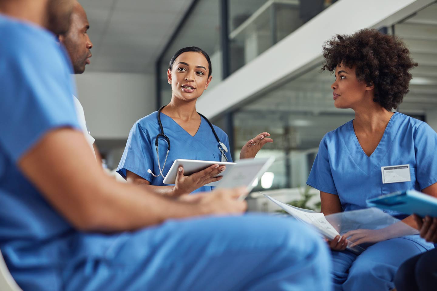 Healthcare professional speaking with a patient